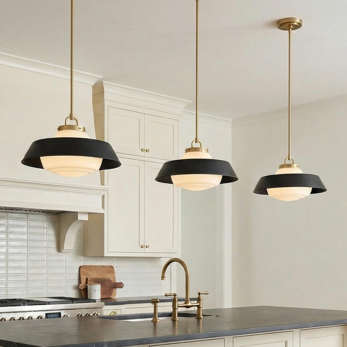 Blaine Medium Pendant 16", Brass and Matte Black geometric globe Pendant in a Modern Farmhouse Kitchen with white shaker cabinets.