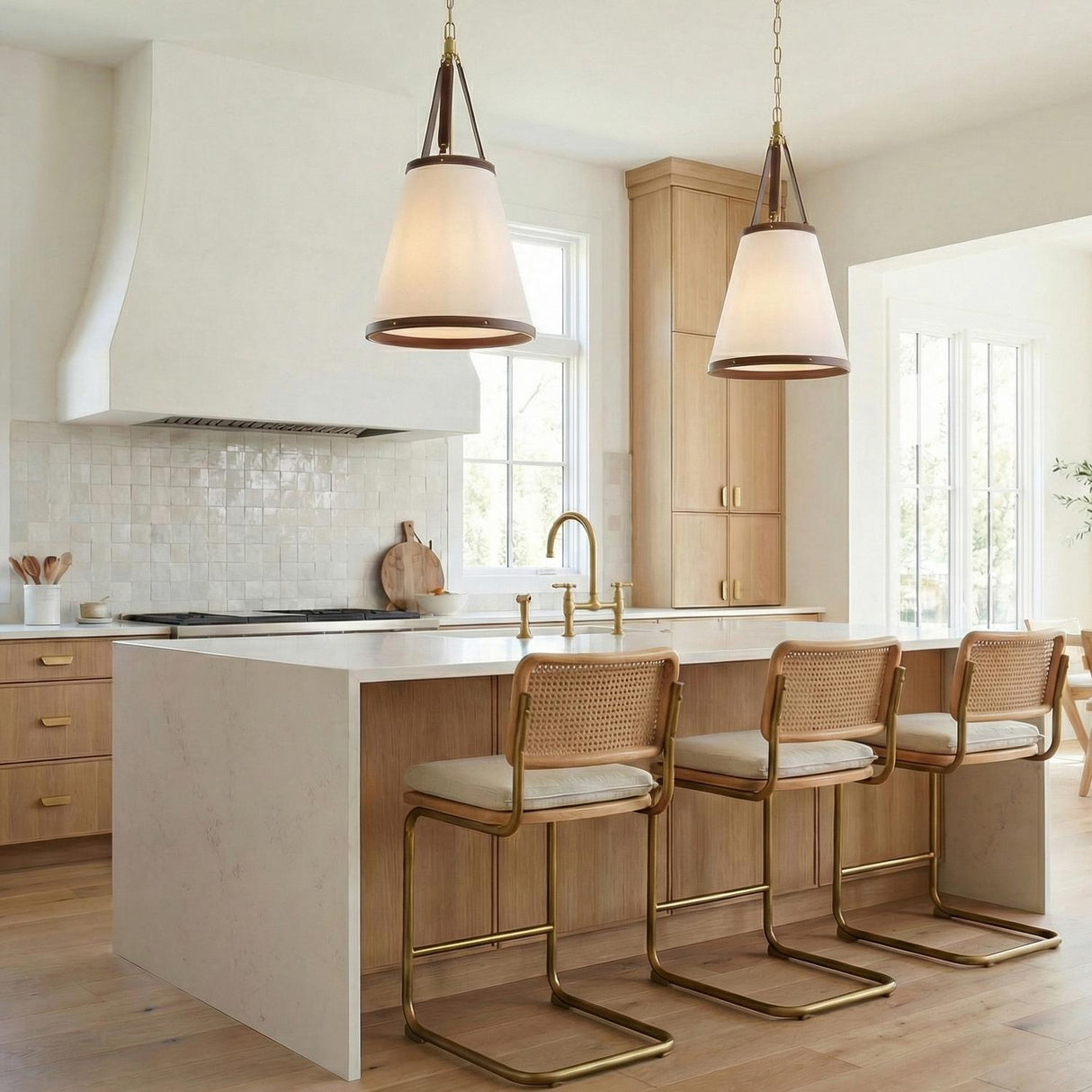 Spencer Pendant 18", Brass with Brown Leather Accents geometric pendant in a Transitional Kitchen with a white marble island.