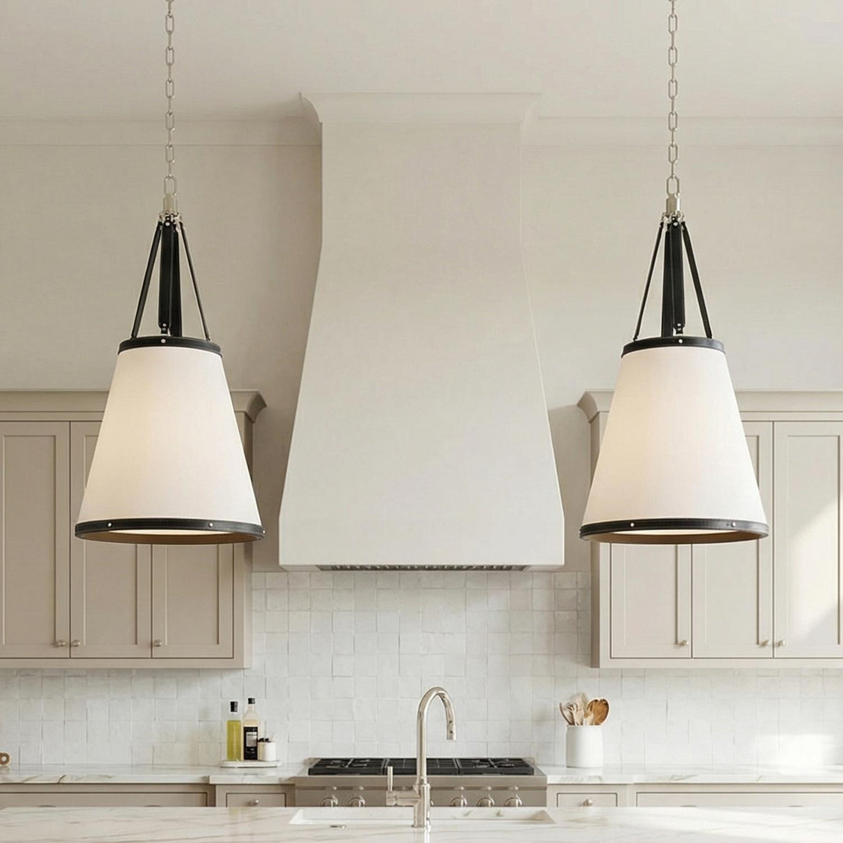 Spencer Pendant, Polished Nickel and Black Leather geometric pendant in a Transitional Kitchen with a white marble island.