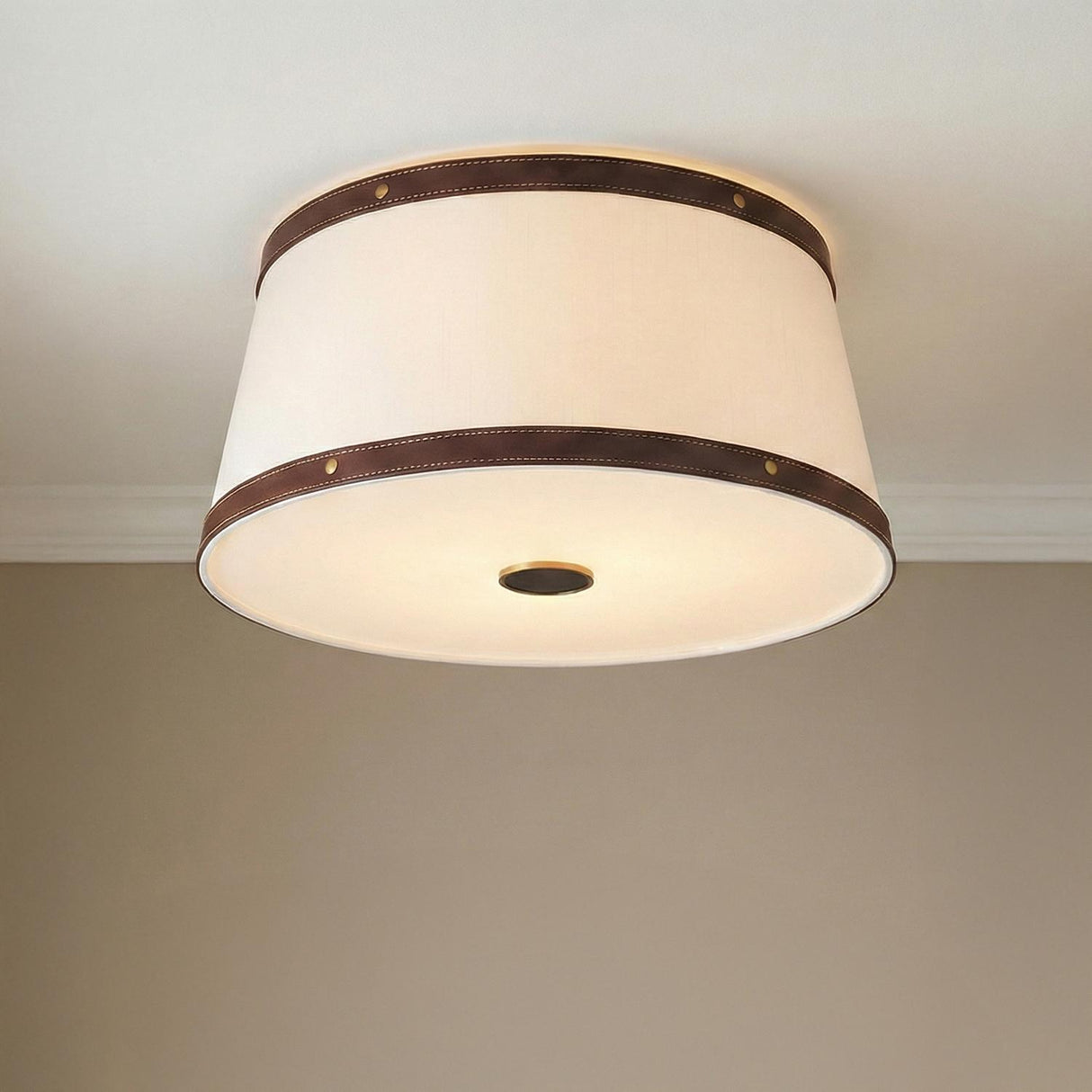 Spencer Flush Mount 17", Brass with Brown Leather Accents geometric flush mount in a Transitional Bedroom with white crown molding.