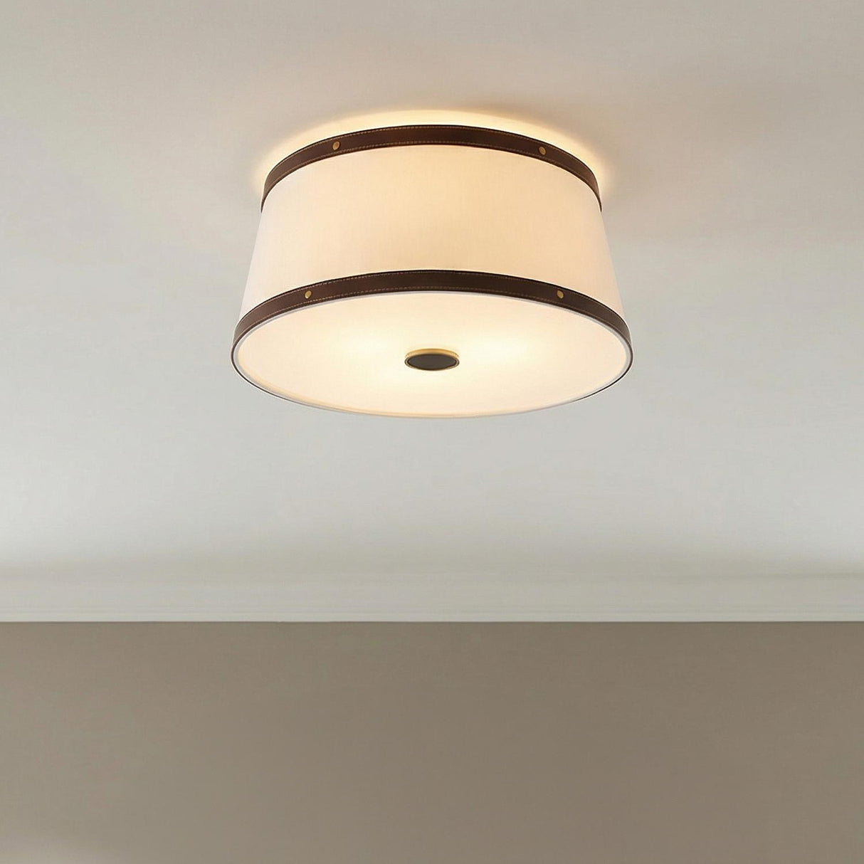 Spencer Flush Mount 17", Brass with Brown Leather Accents geometric flush mount in a Transitional Hallway with neutral walls.