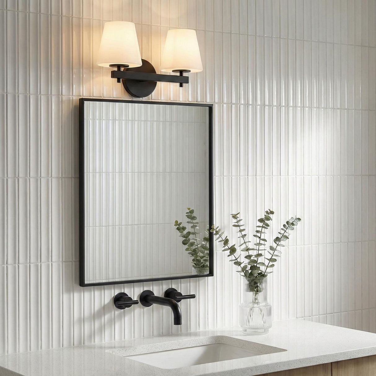 Atticus 2 Light Vanity, Black and Opal Glass linear Vanity in a Contemporary Bathroom with a black framed mirror and vertical tile.