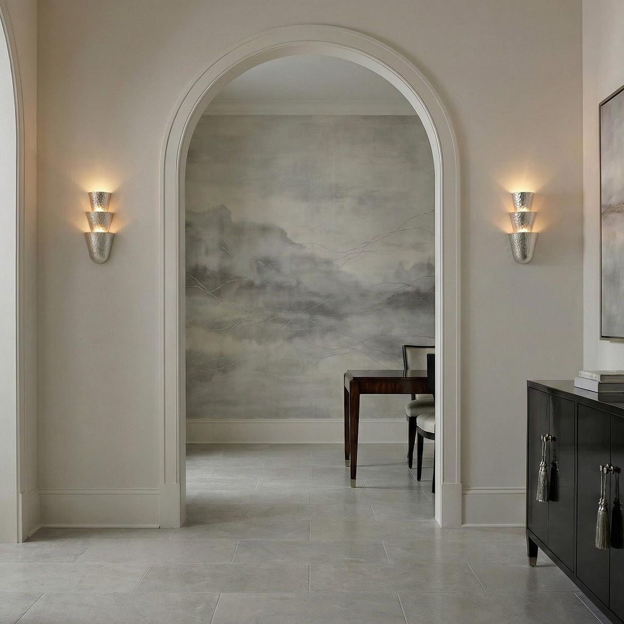 Vedra Wall Sconce 18", Hammered Silver Leaf scalloped texture Wall Sconce in a Transitional Entryway with an arched doorway and gray mural.