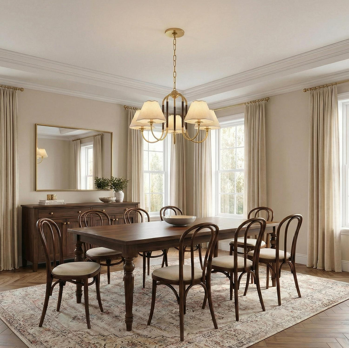Sara 5 Light Chandelier 33", Aged Brass and Bronze scalloped Chandelier in a Transitional Dining Room with a walnut table.