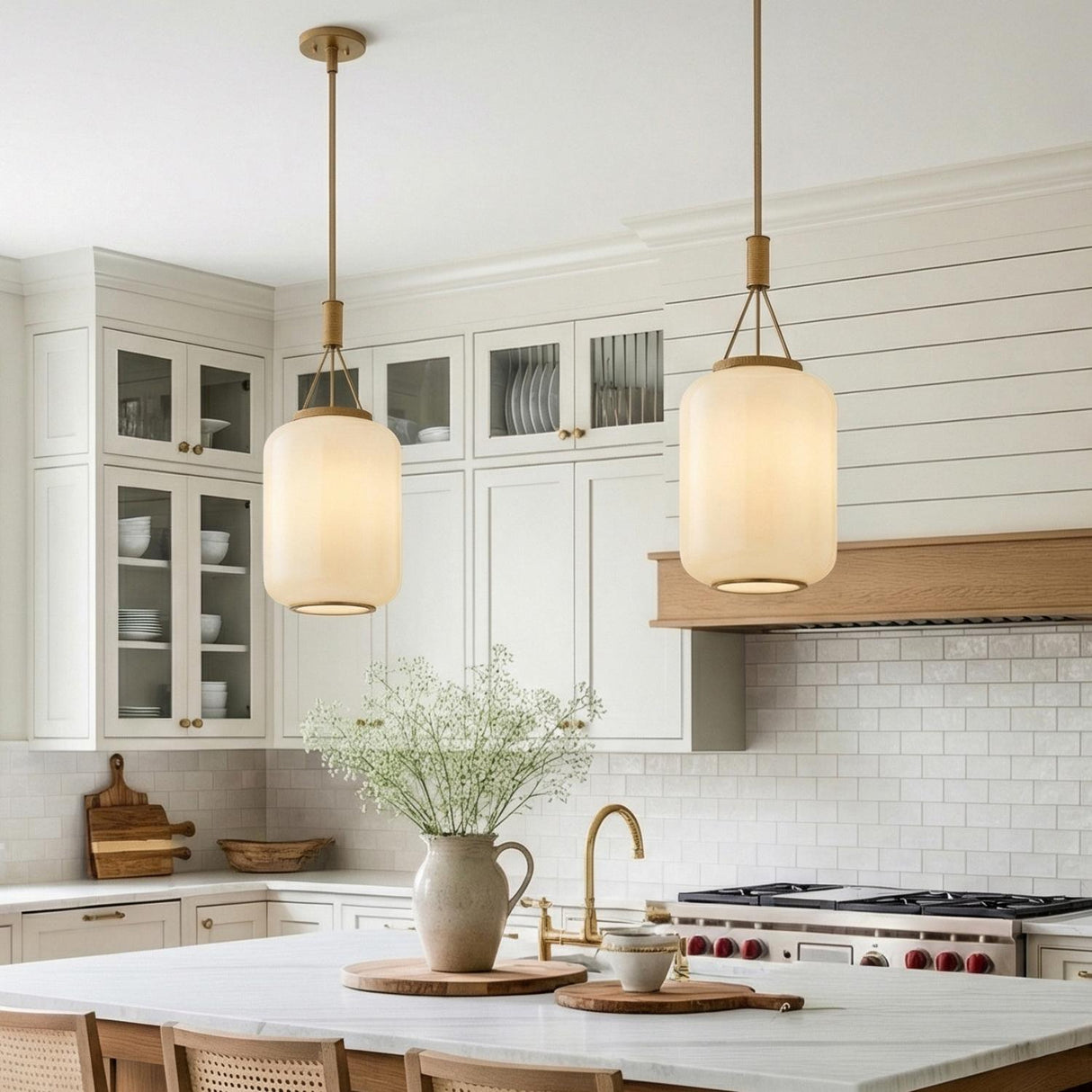 Yuma Pendant 14", Patina Brass and Rattan with Cream Milk Glass woven globe pendant in a Modern Farmhouse Kitchen with a marble island.