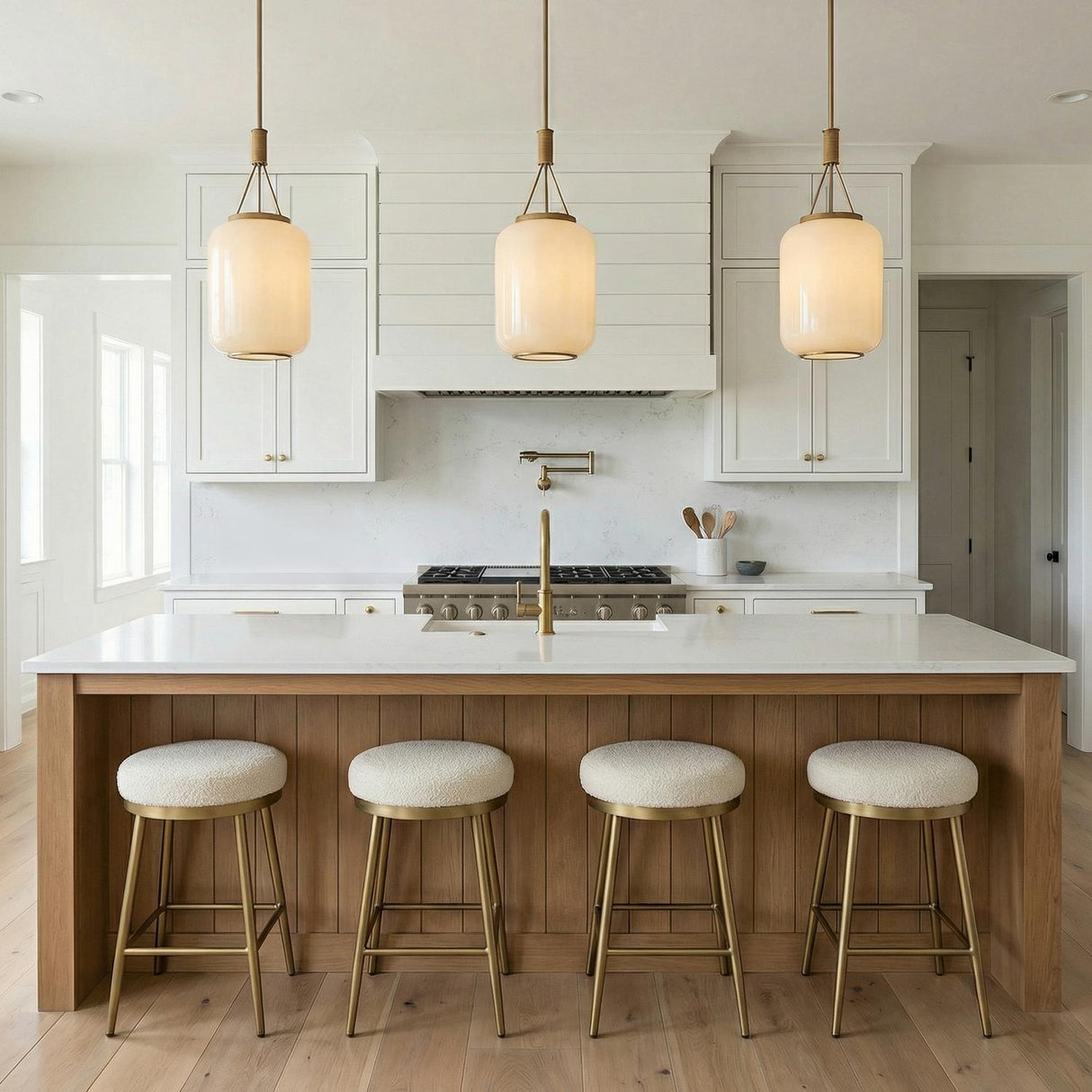 Yuma Pendant 14", Patina Brass and Rattan with Cream Milk Glass woven Pendant in a Modern Farmhouse Kitchen with a white marble island.
