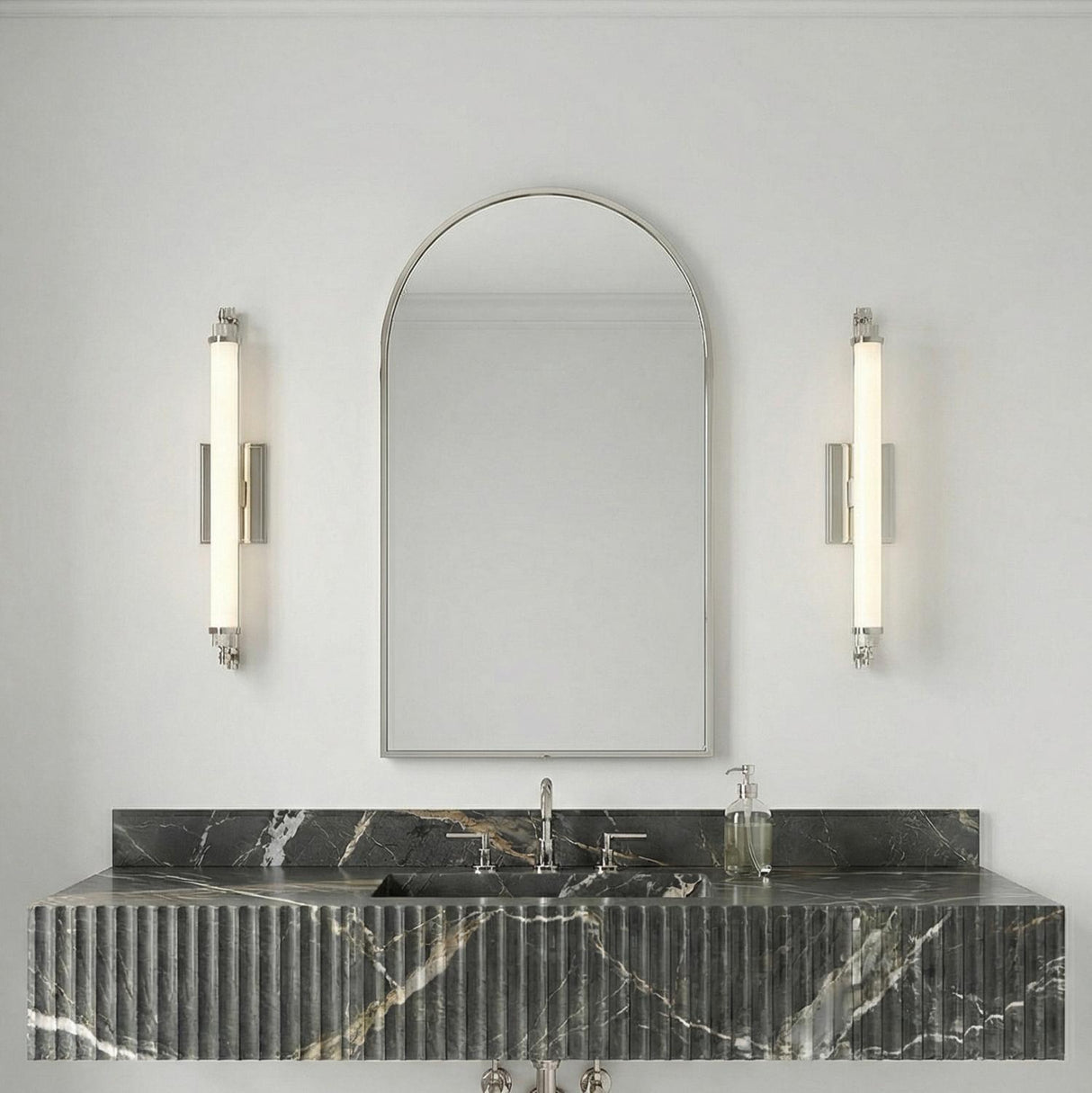 Empire LED Wall Sconce 28", Polished Nickel linear Wall Sconce in a Modern Bathroom with a black fluted marble vanity.