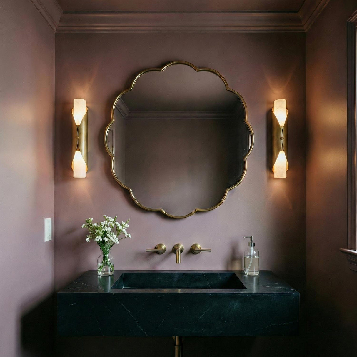 Alessio Medium Wall Sconce 18", Distressed Brass and Alabaster geometric Wall Sconce in a Transitional Bathroom with a scalloped mirror.