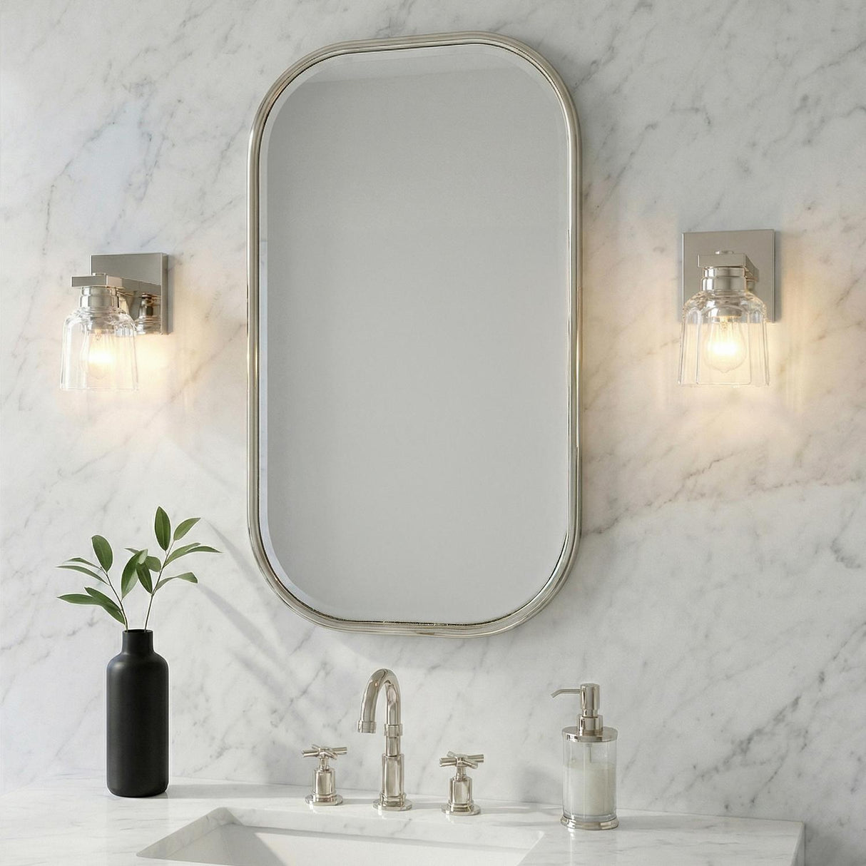 Kurt Polished Nickel scalloped glass Wall Sconce in a Transitional Bathroom with a white marble backsplash and oval mirror.