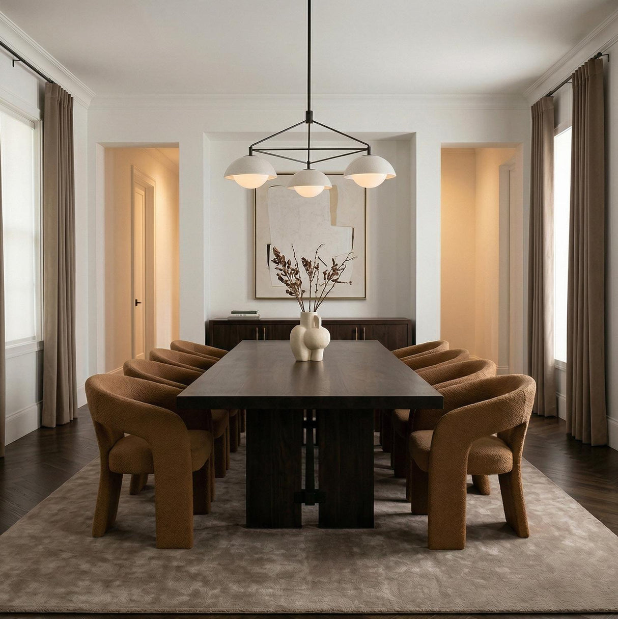 Hanley 3 Light Chandelier 38", Black with Ivory globe Chandelier in a Modern Dining Room with a dark wood table and curved chairs.