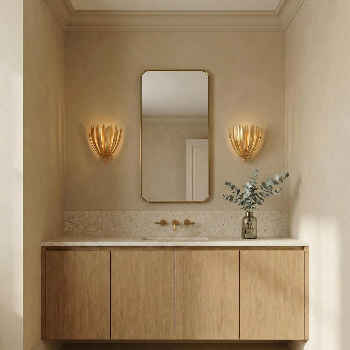 Yasmin Wall Sconce 13", Gold Leaf leaf design Wall Sconce in a Contemporary Bathroom with a floating wood vanity and terrazzo counter.