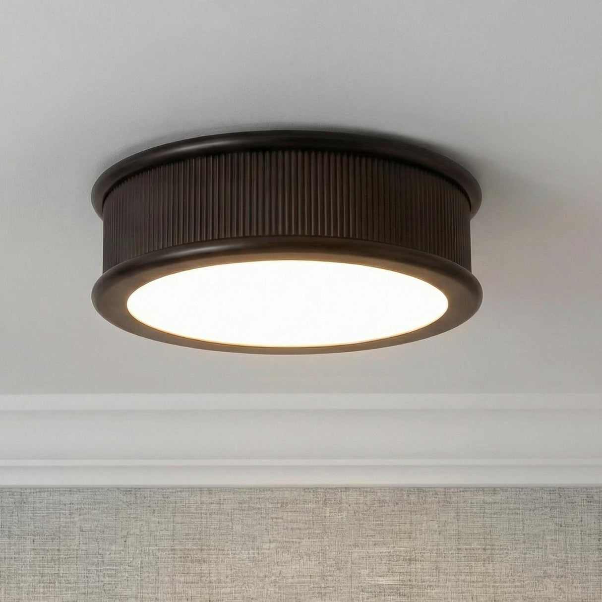 Bishop Large Flush Mount 18", Aged Iron geometric flush mount in a Transitional Hallway with textured wallpaper and crown molding.