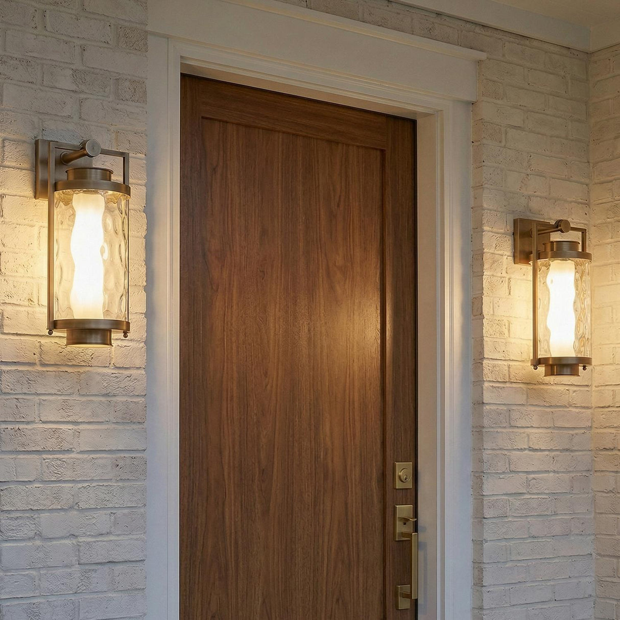 Catalina LED Outdoor Wall Light, Medium 17", Patina Brass geometric Outdoor Wall in a Modern Farmhouse Outdoor with a white brick wall.