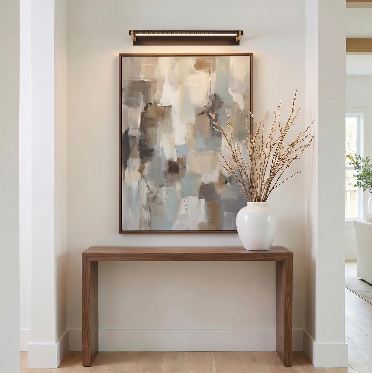 Heath LED Picture Light 30", Distressed Bronze and Aged Brass linear picture light in a Modern Entryway with an abstract painting.