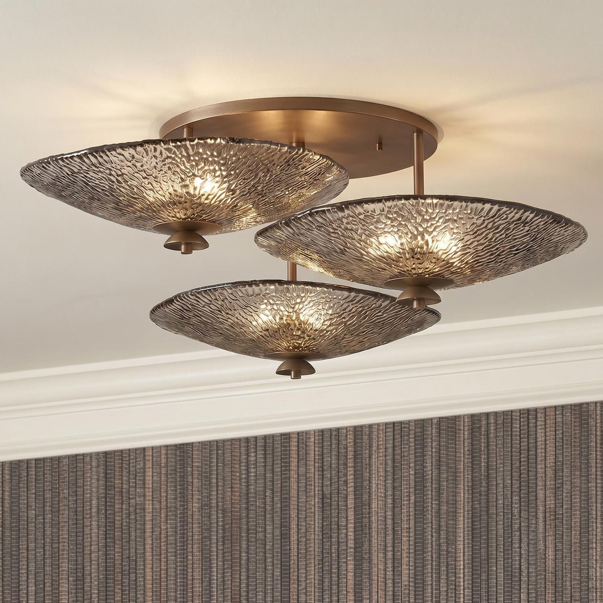 Azaria 3 Shade Semi-Flush 36", Bronze Piastra Glass scalloped flush mount in a Transitional Entryway with striped wallpaper.