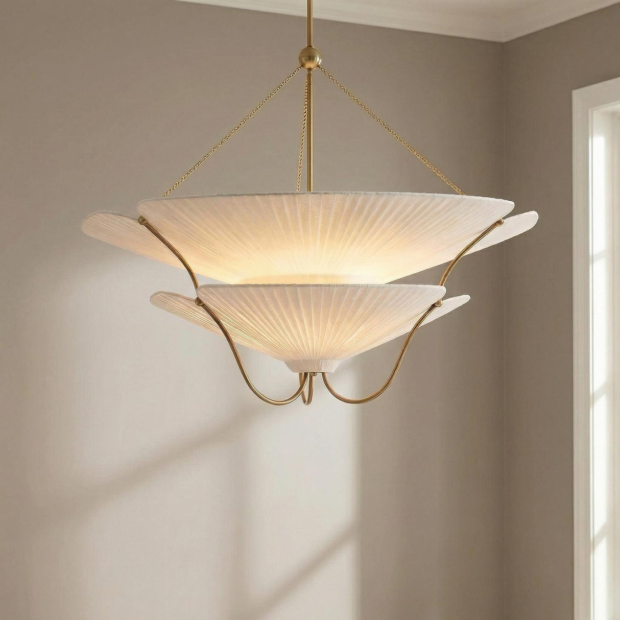 Marcelle Oversized Pendant 40", Aged Brass and Linen leaf design Pendant in a Transitional Dining Room with neutral walls.