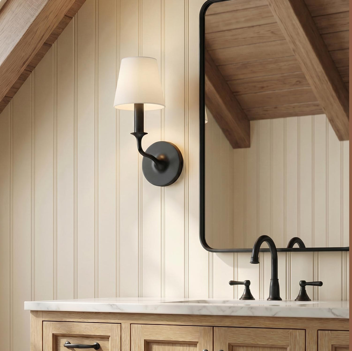 Harwick Wall Sconce 13", Aged Iron geometric Wall Sconce in a Modern Farmhouse Bathroom with a white marble vanity and beadboard walls.