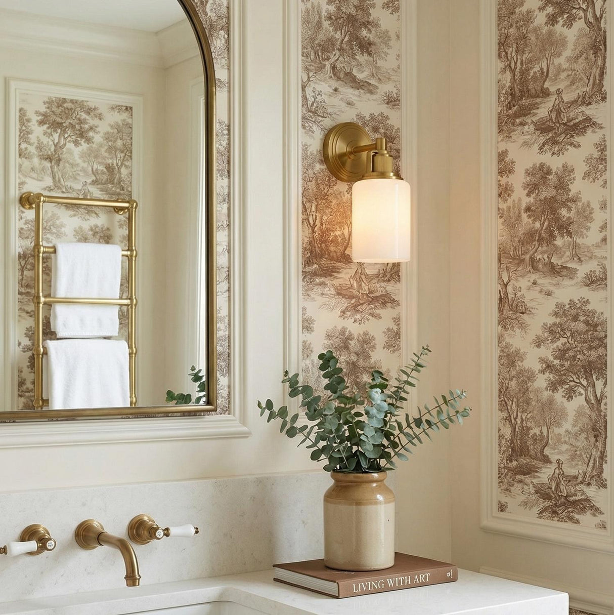 Claxton Wall Sconce 11", Modern Brass geometric Wall Sconce in a Traditional Bathroom with toile wallpaper and an arched mirror.