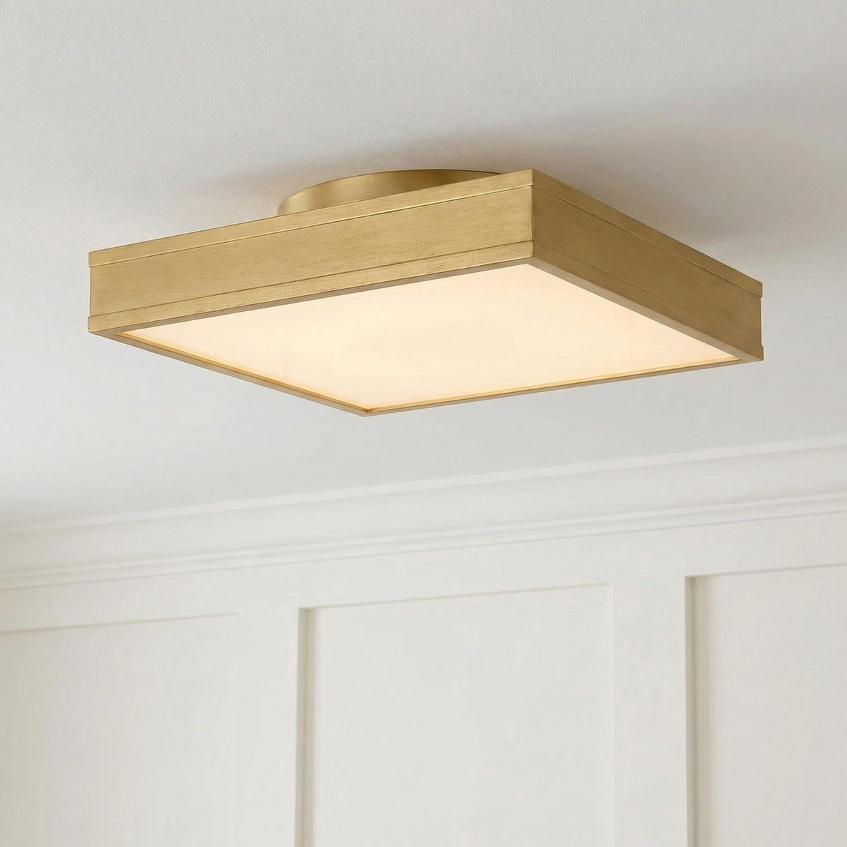 Merton Square LED Semi-Flush 16", Gilded Brass geometric flush mount in a Transitional Entryway with white wall paneling.