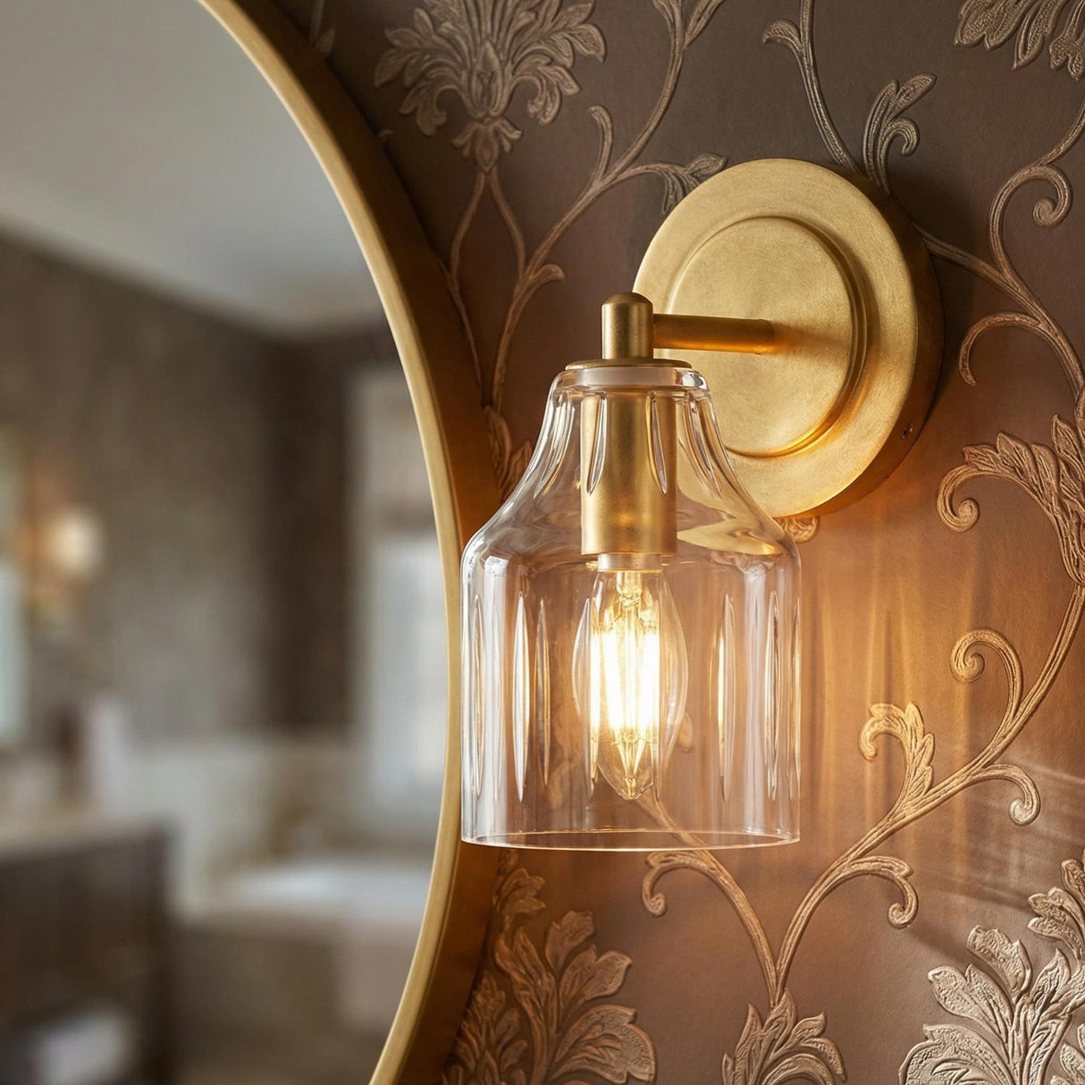 Radwell Wall Sconce 8", Gilded Brass scalloped Wall Sconce in a Traditional Bathroom with ornate damask wallpaper.