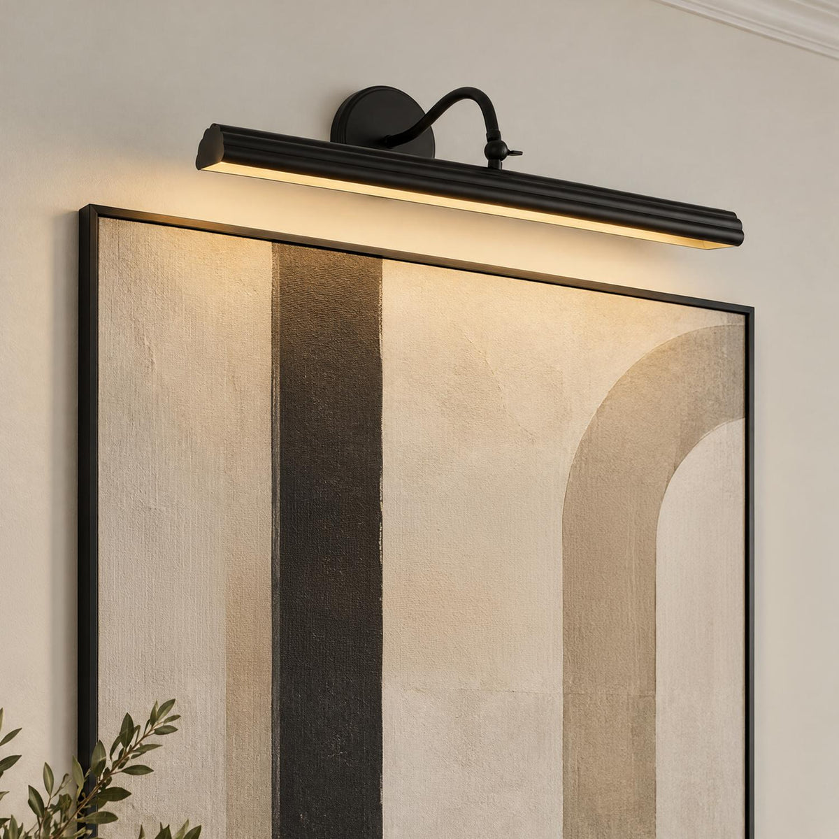 A transitional living room featuring the Jacob LED Picture Light 24", Matte Black mounted on a beige wall above a large framed abstract canvas.