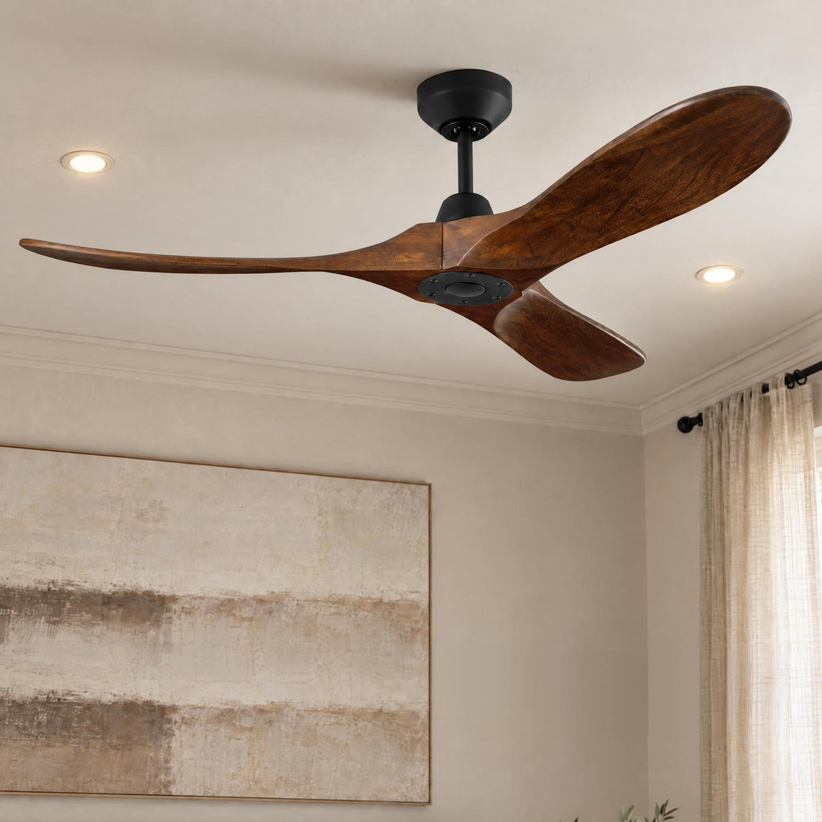 A modern living room with the Egret Ceiling Fan 52", Walnut Wood and Matte Black installed on the ceiling near abstract wall art and linen curtains.