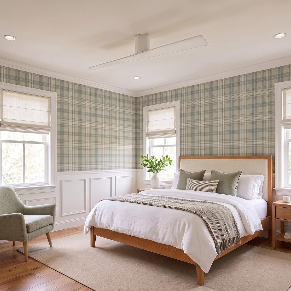 A transitional bedroom featuring the Finch Smart Ceiling Fan 60 in matte white oak centered on the ceiling above a wooden bed frame and plaid wallpaper.