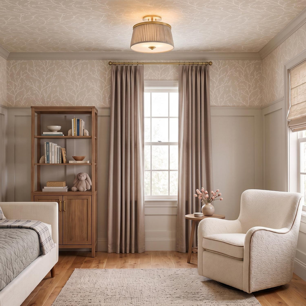 A transitional bedroom with the Wilma Semi-Flush 16 in aged brass and taupe print along the ceiling center above a cream armchair and botanical wallpaper.