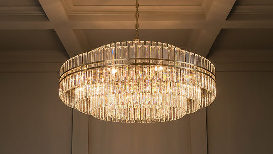Shop crystal and glass chandeliers featuring sparkling crystal drops, faceted accents, and sculptural glass designs in styles from classic glamour to modern. Maxwell Chandelier shown in Brass & Crystal.