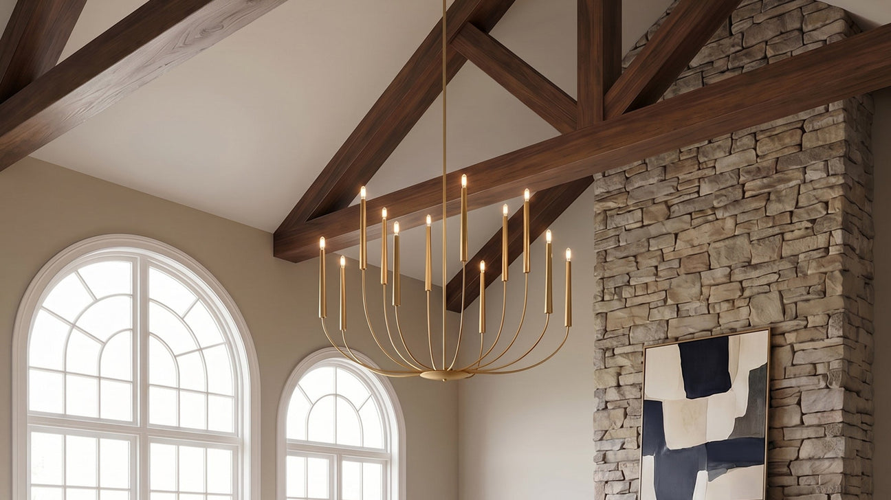 Solana 12 Light Chandelier 48", Modern Brass finish is shown in a grand living room with beams and stone fireplace.