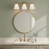Carlisle 3 Light Vanity, Brushed Brass with Opal Glass - Vanity light above a round mirror in a sage green bathroom