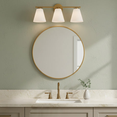 Carlisle 3 Light Vanity, Brushed Brass with Opal Glass - Vanity light above a round mirror in a bathroom