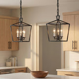 Anover Small Lantern Pendant 9.5", Matte Black geometric Pendant in a Modern Farmhouse Kitchen with light wood cabinets and marble island.