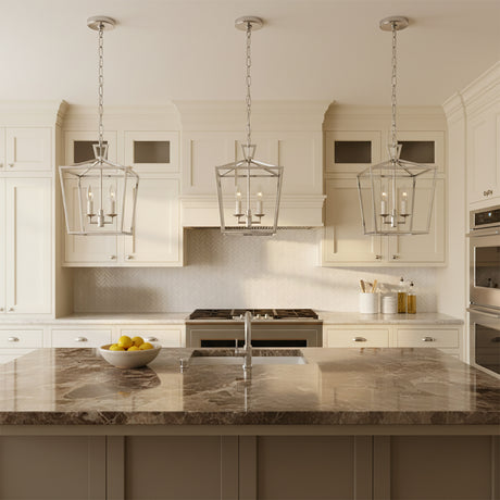 Anover Small Lantern Pendant 9.5, Polished Nickel - Three polished nickel lantern pendants illuminate a modern kitchen island with a marble countertop.