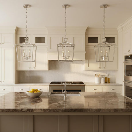 Anover Small Lantern Pendant 9.5, Polished Nickel - Three polished nickel lantern pendants illuminate a modern kitchen island with a marble countertop.