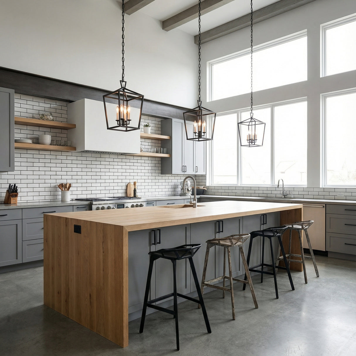 Anover Medium Lantern Pendant 13", Matte Black geometric Pendant in a Modern Farmhouse Kitchen with a large wooden island.