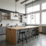 Anover Medium Lantern Pendant 13", Matte Black geometric Pendant in a Modern Farmhouse Kitchen with a large wooden island.