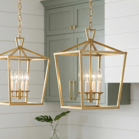 A farmhouse kitchen featuring two Anover Medium Lantern Pendant 13 inch Satin Brass fixtures over the island, accented by sage green cabinetry and white shiplap walls.