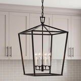 A modern farmhouse kitchen with the Anover Large Lantern Pendant 17", Matte Black hanging over the island against light gray shaker cabinets and a white square tile backsplash.
