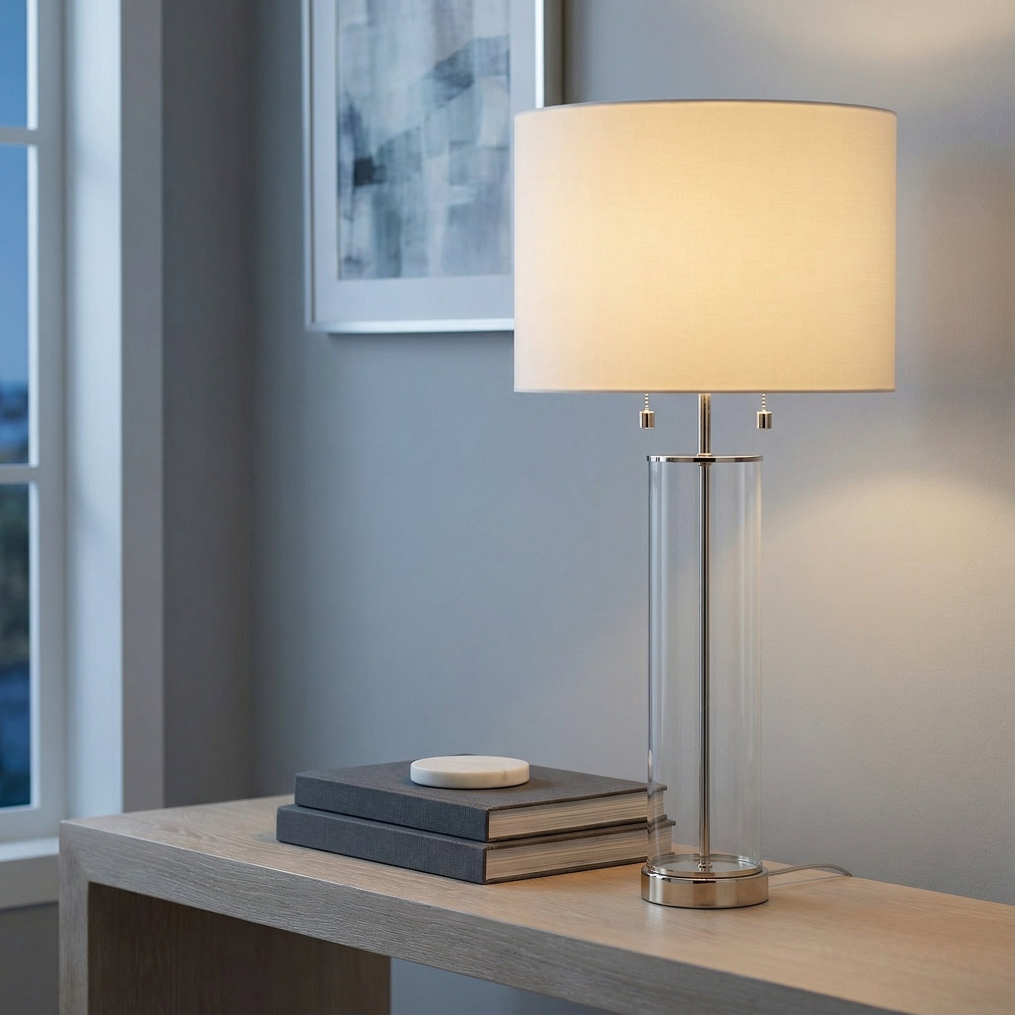 Clear Glass Cylinder Table Lamp, Polished Nickel linear Table Lamp in a Modern Entryway with a wooden console table.