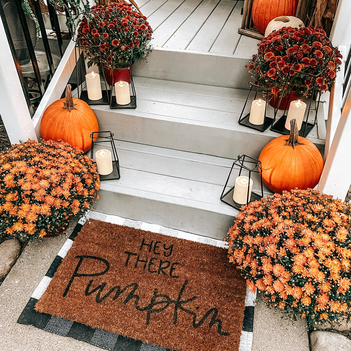 Perry Open Frame Lantern with Flameless Candle, Medium and Large, on a front porch with pumpkins