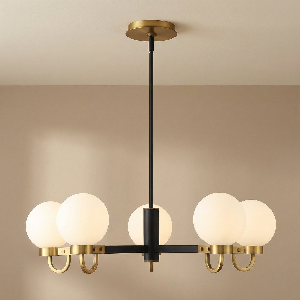 Sola 6-Light Chandelier, Matte Black and Aged Brass globe chandelier in a Modern Living Room.