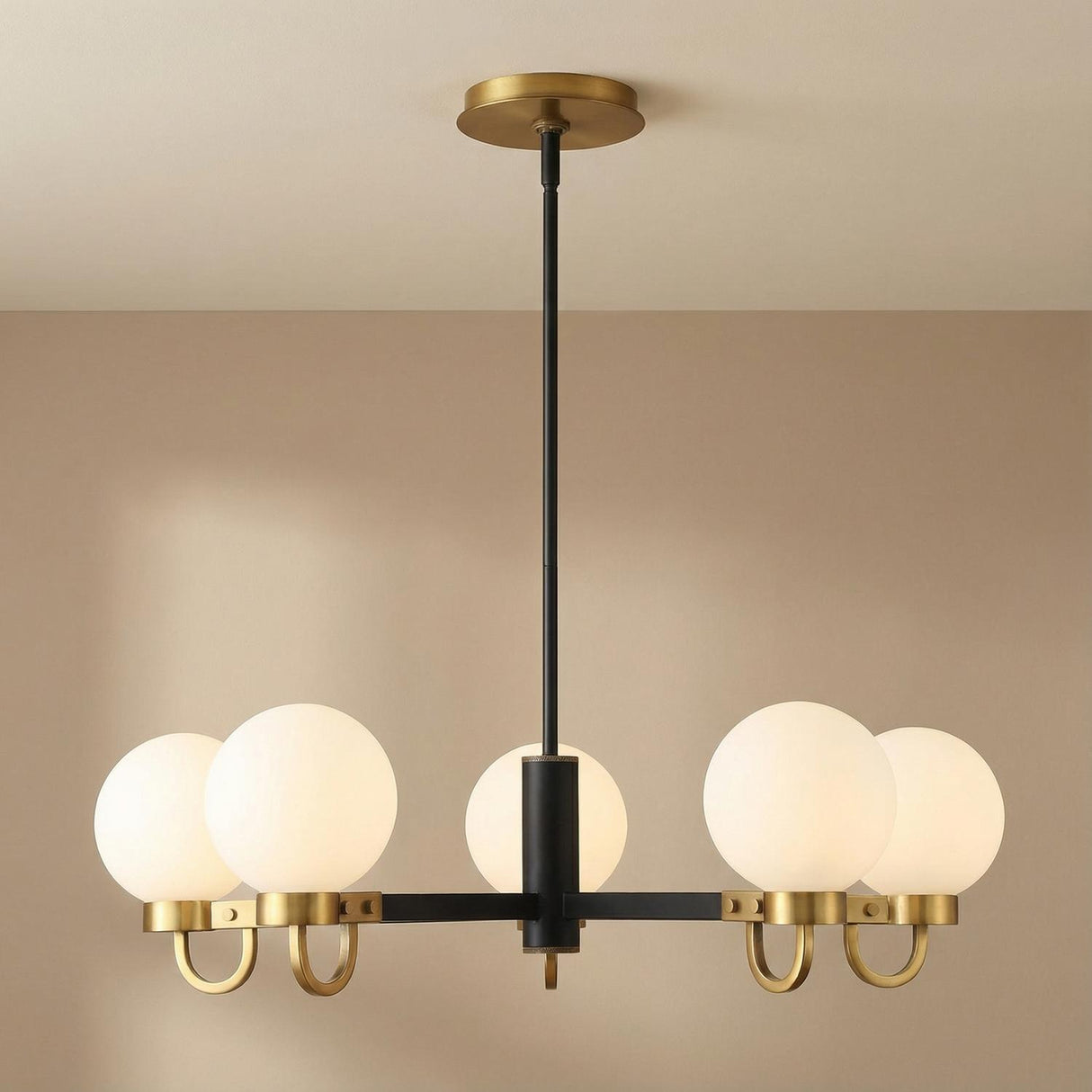 Sola 6-Light Chandelier, Matte Black and Aged Brass globe chandelier in a Modern Living Room.