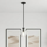 Eva 9" Clear Diamond Pendant, Matte Black geometric Pendant in a Modern Living Room with desert landscape framed art.