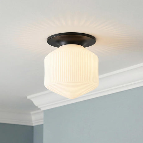 Jules Glass Flush Mount, Matte Black with Opal Glass geometric flush mount in a Transitional Hallway with white crown molding.
