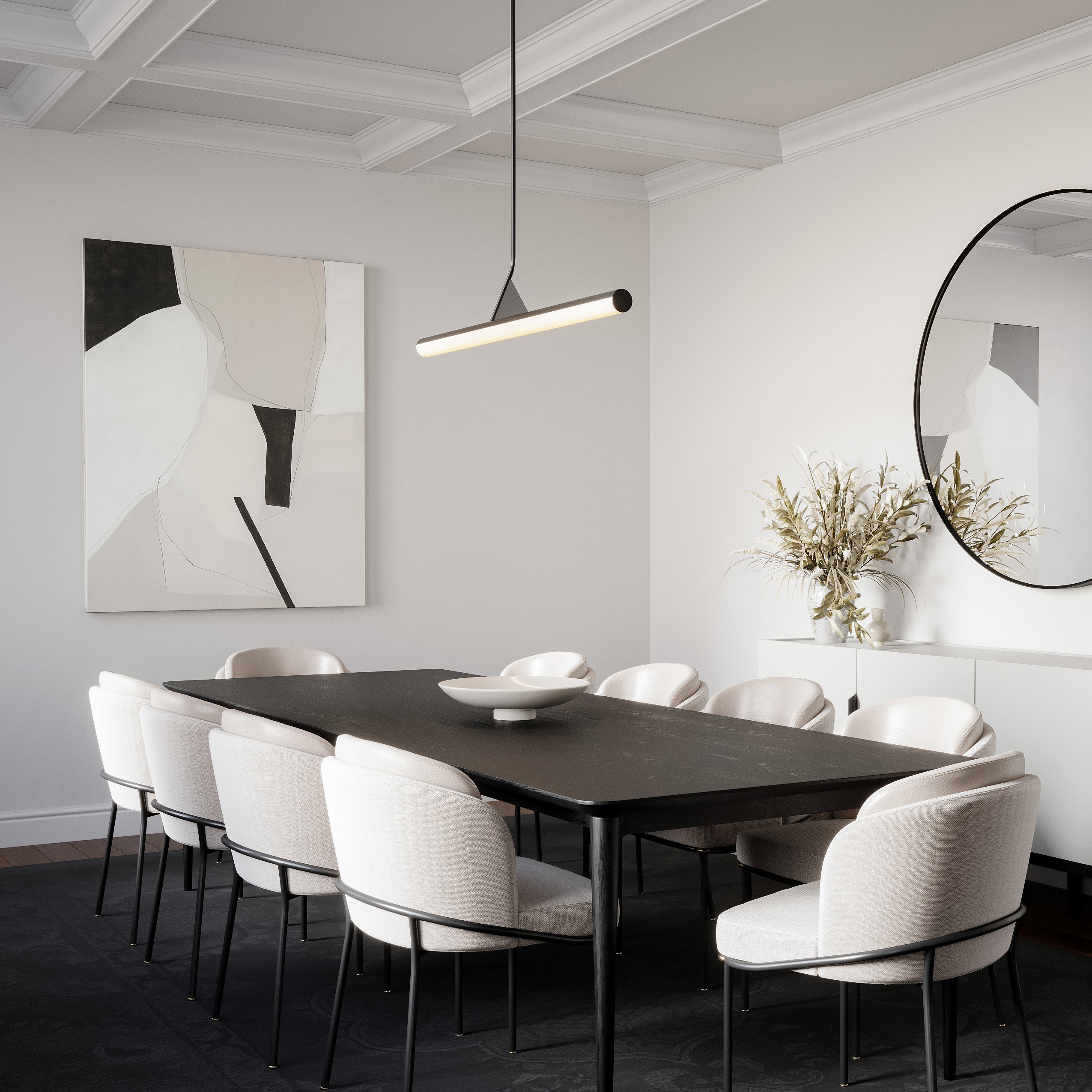 Modern dining room featuring a black table, white chairs, a round mirror, abstract wall art, and illuminated by a sophisticated modern 45