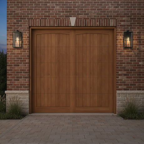 Sam Outdoor Wall Light, Medium 18" - Two black outdoor wall lights flanking a wooden garage door