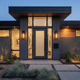 Large 24" Matte Black linear Outdoor Wall light in a Modern Outdoor with dark stucco walls & modern landscaping.