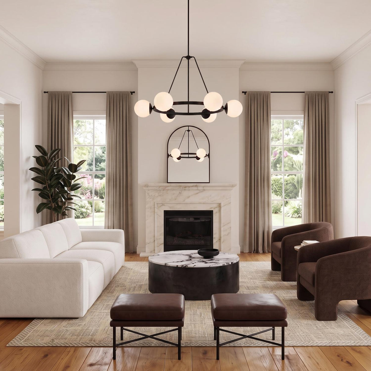 A contemporary living room with the Castell 6 Globe Round Chandelier 36", Matte Black featuring frosted glass globes centered above a marble coffee table and white sofa.