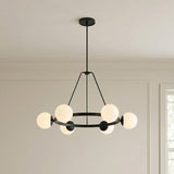 Castell 6 Globe Round Chandelier 36", Matte Black globe Chandelier in a Transitional Dining Room with wall paneling and a grid window.